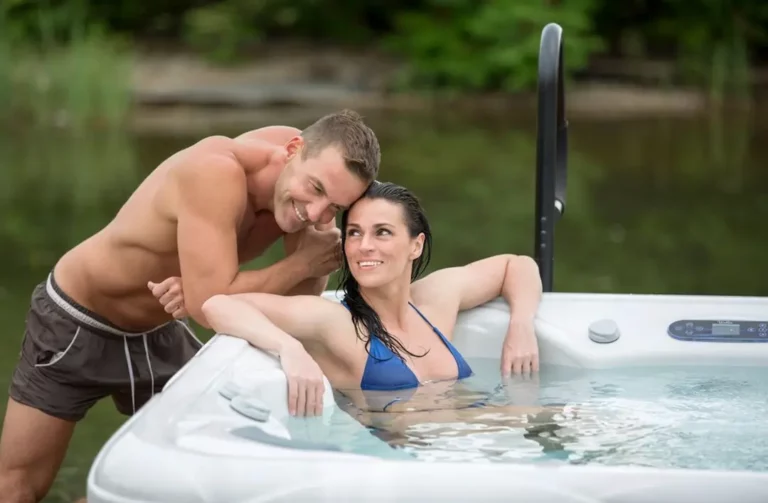 Picture of a couple in a plug and play hot tub.